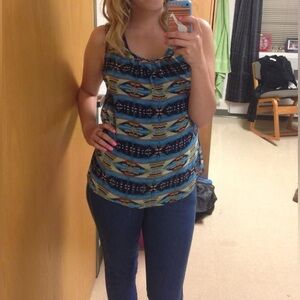 Very flowing lite top. Partially open back multicolored mostly blue